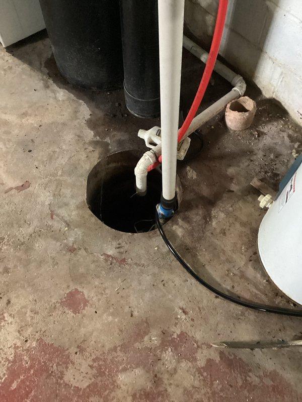 Completed installation of new air conditioning system and evaporator coil in residential property. The new HVAC equipment was installed in the basement utility area, with proper integration to existing ductwork and drainage systems, including PVC condensate lines routed through floor penetrations. All connections were secured, system was tested for proper operation, and unit is functioning within manufacturer specifications.