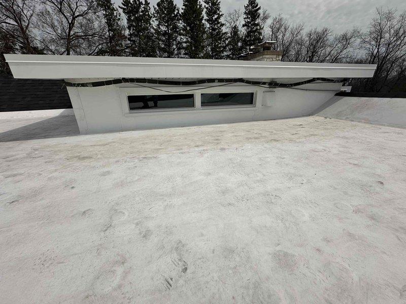 Conducted commercial HVAC estimate for mini split system installation on flat TPO rooftop with existing condenser unit present. Assessed rooftop conditions, structural requirements, and optimal placement for new mini split outdoor unit near stone facade exterior wall. Evaluated electrical routing options and refrigerant line pathways to ensure code-compliant installation while maintaining weatherproof membrane integrity.