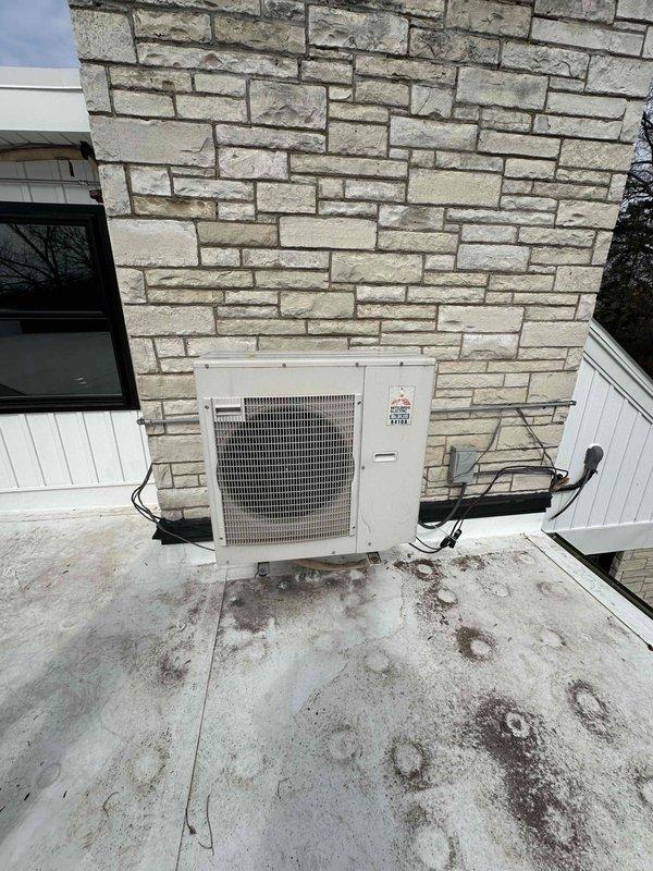 Conducted commercial HVAC estimate for mini split system installation on flat TPO rooftop with existing condenser unit present. Assessed rooftop conditions, structural requirements, and optimal placement for new mini split outdoor unit near stone facade exterior wall. Evaluated electrical routing options and refrigerant line pathways to ensure code-compliant installation while maintaining weatherproof membrane integrity.