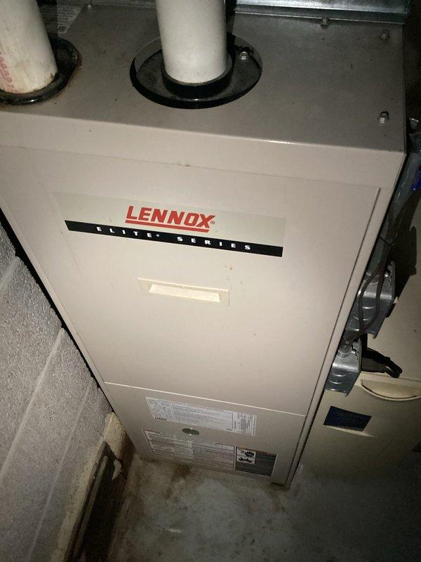 Performed preventive maintenance and inspection on Lennox Elite Series high-efficiency gas furnace. Accessed and inspected blower motor assembly, verified proper operation of all electrical connections and components, and confirmed condensate drainage system functionality. All system components found to be operating within normal parameters, with furnace cycling properly and venting correctly through PVC exhaust pipes.