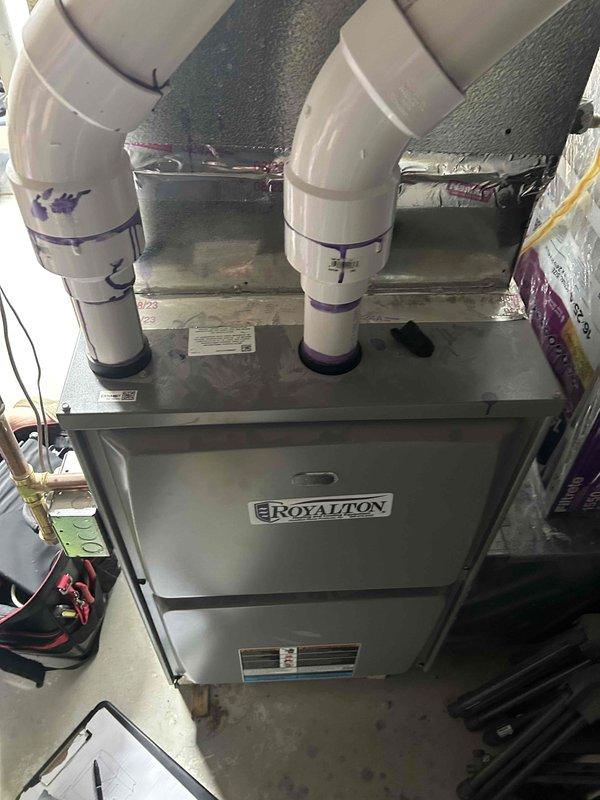 Completed HVAC system replacement estimate for residential property. Assessed existing Royalton furnace unit located in utility room, evaluating current ductwork configuration including flexible metal ducts, PVC intake/exhaust venting system, and associated copper piping connections. Documented equipment condition, spatial constraints, and installation requirements to provide comprehensive replacement recommendations for upgraded heating and cooling system.