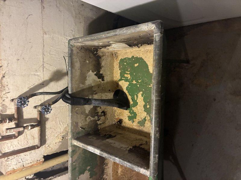 Conducted comprehensive water service estimate inspection in basement utility area. Assessed aging infrastructure including corroded electrical junction box with significant rust deterioration, multiple water supply lines with brass fittings, and associated piping systems requiring evaluation for potential replacement or repair to ensure safe and reliable water service operation.