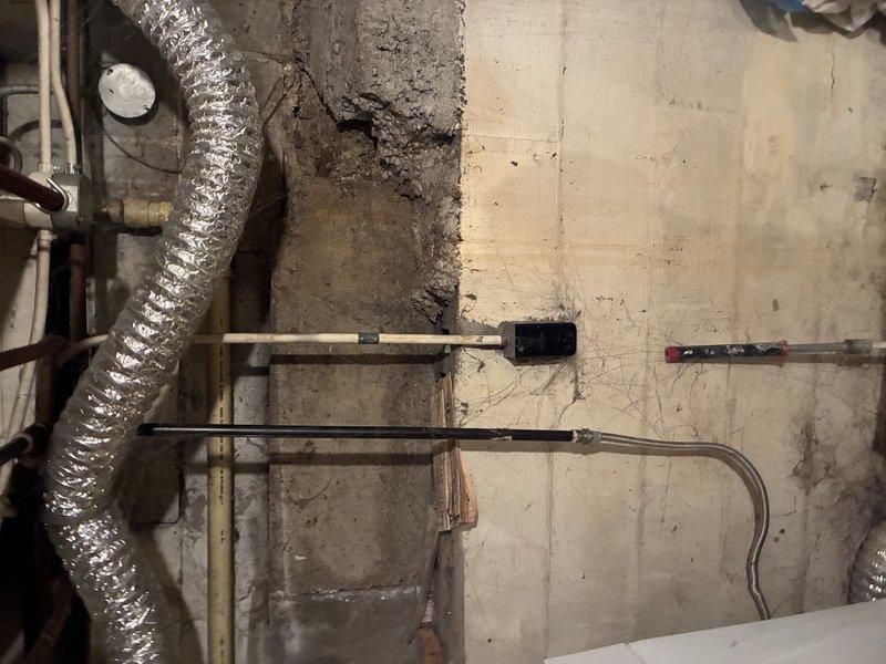 Conducted comprehensive water service estimate inspection in basement utility area. Assessed aging infrastructure including corroded electrical junction box with significant rust deterioration, multiple water supply lines with brass fittings, and associated piping systems requiring evaluation for potential replacement or repair to ensure safe and reliable water service operation.