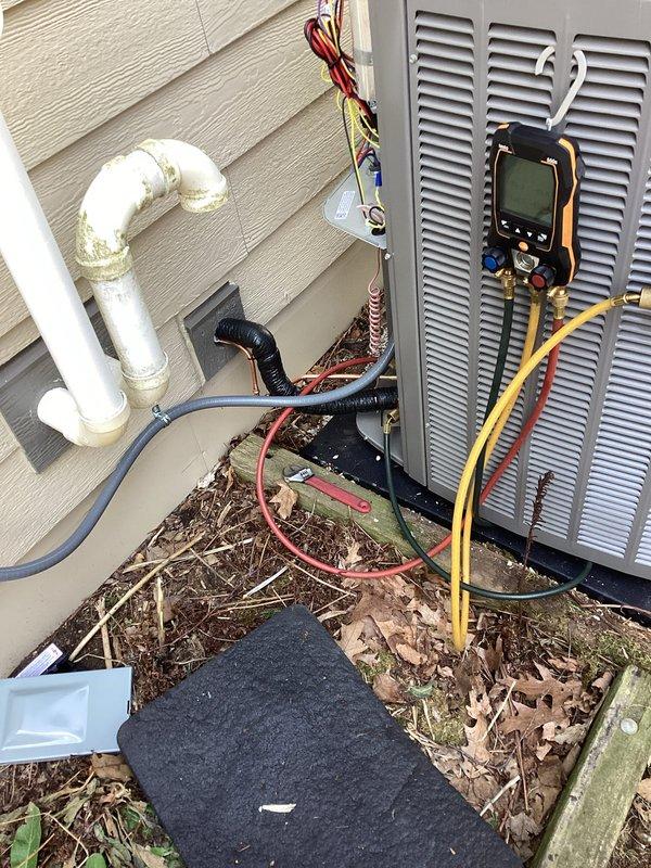 Completed installation of new outdoor A/C condenser unit and evaporator coil system at residential property. Connected refrigerant lines, installed equipment on pad, performed system startup with manifold gauge testing to verify proper refrigerant charge and operating pressures, and ensured all electrical connections and condensate drainage were functioning correctly.