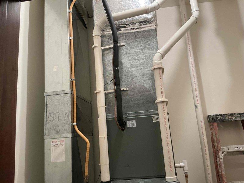 Completed comprehensive HVAC system evaluation for equipment replacement in residential basement mechanical room. Assessed existing Rheem Classic 90 Plus high-efficiency gas furnace and associated air handler system, documenting current equipment configuration, ductwork layout, and supporting infrastructure including PVC condensate/venting lines, copper gas supply line, electrical service connections, and flexible duct transitions. Photographed equipment conditions, manufacturer labels, energy ratings, and mechanical room layout to provide detailed documentation for replacement system specifications and installation planning.