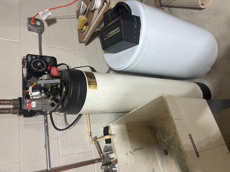 Installed complete water treatment system in basement utility area, including water softener with programmable control valve and brine tank for salt storage. Connected system to existing copper plumbing infrastructure with proper shutoff valves, ensuring integration with water heater and utility sink. Tested all connections for proper operation and verified system settings for optimal water conditioning performance.