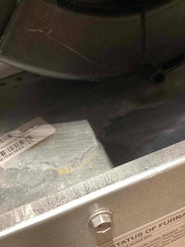 # Warranty Service Completed

Performed warranty inspection on residential HVAC system. Examined internal components including refrigerant lines, drain connections, and condensate management system. Verified proper installation of drain hose with secure clamp connections and confirmed all mechanical fittings were properly seated. Documented equipment nameplate information and serial number for warranty verification. All components found to be functioning within manufacturer specifications with no defects identified.
