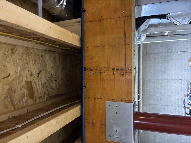 # Outdoor Spigot Installation and Plumbing Rough-In

Completed installation of outdoor spigot plumbing system during construction phase, routing new water supply lines through unfinished basement ceiling structure. Installed PVC and PEX piping with proper mounting brackets and clips along exposed floor joists, ensuring secure attachment and appropriate slope for drainage. Coordinated pipe routing with existing electrical conduit and HVAC systems to maintain proper clearances and building code compliance, preparing infrastructure for final connection to exterior hose bib fixture.