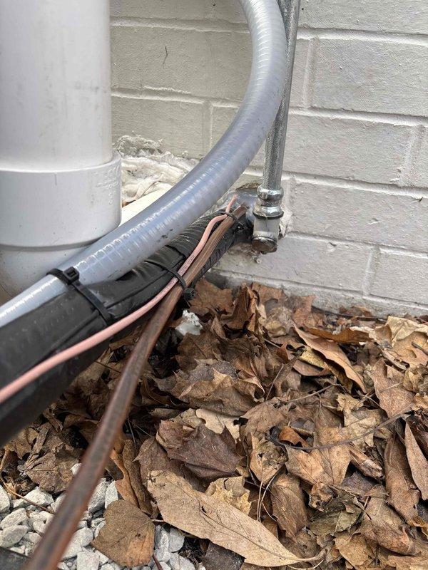 Completed installation of new air conditioning system and evaporator coil at residential property. New A/C condenser unit was positioned and secured at exterior location with proper refrigerant line sets, electrical connections, and condensate drainage routed through exterior wall penetration. Indoor evaporator coil was installed and integrated with existing furnace system in basement utility area, with all copper refrigerant lines properly insulated and secured throughout the installation path. System was charged to manufacturer specifications, tested for proper operation, and verified for adequate airflow and temperature differential.