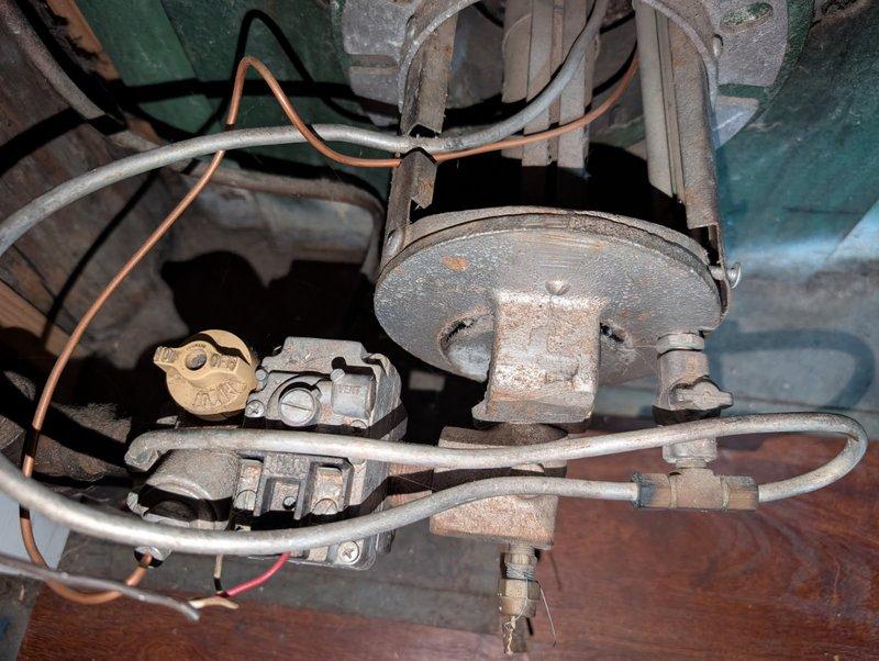 # HVAC Service Report - No Heat Call

Responded to no heat call on furnace unit less than 10 years old. Upon arrival, conducted visual inspection of heating system components. Examined gas valve assembly and motor blower assembly for proper operation and signs of wear or malfunction.

Gas valve showed normal wear consistent with age but displayed proper mechanical integrity. Checked all electrical connections including wiring to gas valve control circuit. Verified red control wire connections and examined copper gas supply lines for leaks or restrictions. All gas piping connections were secure with no detected leaks.

Inspected blower motor assembly including electrical terminals and mechanical linkage components. Motor housing exhibited dust accumulation typical of normal operation. Verified all mounting hardware and brackets were properly secured. Checked motor capacitor and electrical connections for continuity and proper voltage supply.

Tested thermostat call for heat and confirme