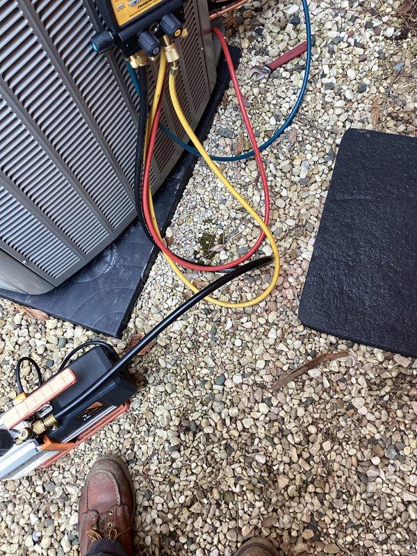 # HVAC Install - Complete System

Completed full installation of new Lennox air conditioning system at residential property. Positioned outdoor condenser unit on level pad against exterior brick wall, secured electrical disconnect box, and ran proper conduit connections. Performed complete refrigerant charging procedure using manifold gauge set with calibrated pressure readings, evacuated system to manufacturer specifications using vacuum pump, and pressure-tested all refrigerant lines for leaks. Connected and verified all copper line sets with proper brazing techniques and insulation. Commissioned system with full operational testing to confirm proper airflow, temperature differential, and electrical parameters meeting Lennox installation standards.