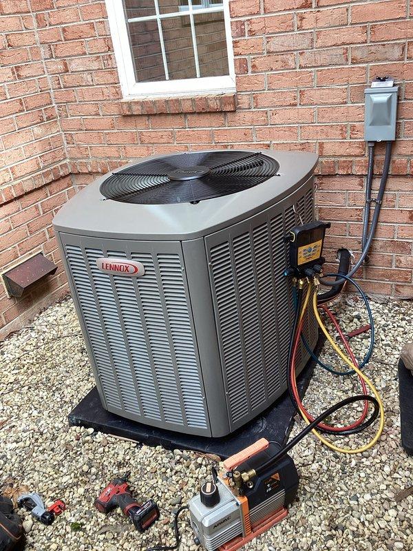 # HVAC Install - Complete System

Completed full installation of new Lennox air conditioning system at residential property. Positioned outdoor condenser unit on level pad against exterior brick wall, secured electrical disconnect box, and ran proper conduit connections. Performed complete refrigerant charging procedure using manifold gauge set with calibrated pressure readings, evacuated system to manufacturer specifications using vacuum pump, and pressure-tested all refrigerant lines for leaks. Connected and verified all copper line sets with proper brazing techniques and insulation. Commissioned system with full operational testing to confirm proper airflow, temperature differential, and electrical parameters meeting Lennox installation standards.