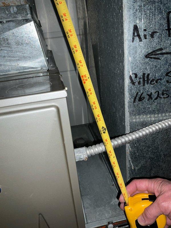 Performed comprehensive evaluation and measurements of existing HVAC system for complete replacement estimate. Assessed current air handler unit dimensions and clearances in mechanical space to determine equipment specifications for new installation. Documented existing Carrier Infinity Touch thermostat system currently displaying operational parameters, which will be evaluated for compatibility with proposed replacement equipment or potential upgrade requirements during system changeout.