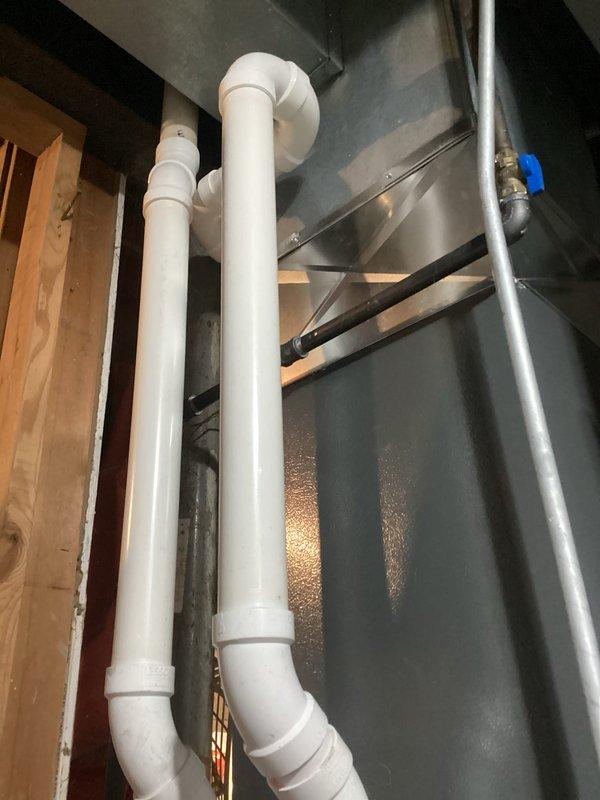 Completed scheduled HVAC maintenance inspection on residential system. Performed diagnostic testing using digital manometer to verify proper system pressures, recording static pressure readings of 45.1 and 448 pascals to ensure optimal airflow and equipment operation. Inspected air handler unit, drainage piping, and associated mechanical components in utility space, confirming all equipment is functioning within manufacturer specifications with no issues identified.