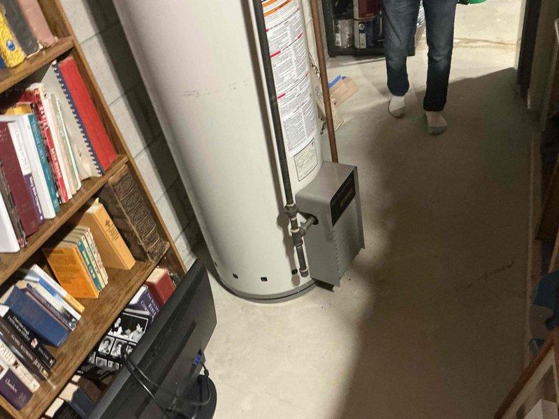 Completed HVAC system assessment in basement mechanical room for equipment replacement estimate. Documented existing furnace/air handler unit, water heater, ductwork configuration, PVC ventilation system, and copper piping layout to provide comprehensive replacement options for aging heating and cooling equipment.