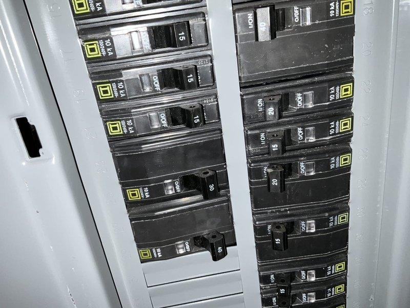 Conducted site assessment for mini split installation at brick exterior building. Evaluated exterior mounting location at building corner near downspout and reviewed existing electrical panel capacity with available circuit breaker spaces for new dedicated circuit requirements. Documented installation site conditions and confirmed electrical infrastructure compatibility for proposed ductless mini split system.