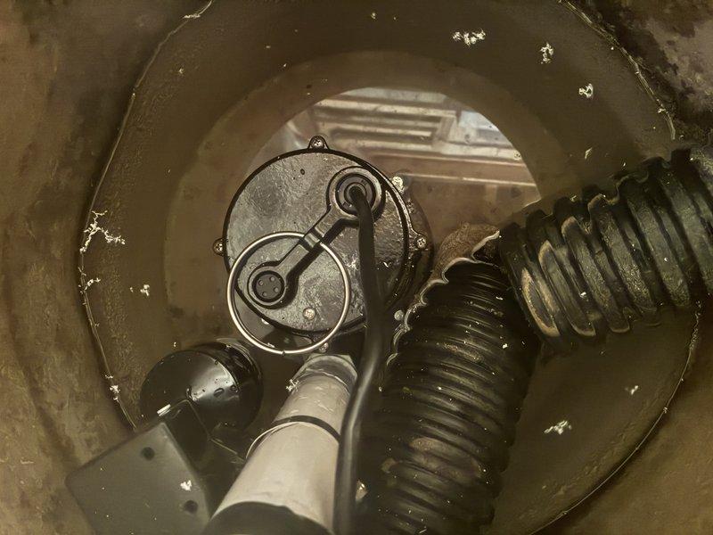 Completed installation of sump pump system in basement utility area, including proper basin placement, discharge piping with PVC components and appropriate fittings, and electrical connections. Verified float switch operation and tested pump functionality to ensure proper water removal and automatic cycling. System is now operational and ready to protect the basement from water accumulation.