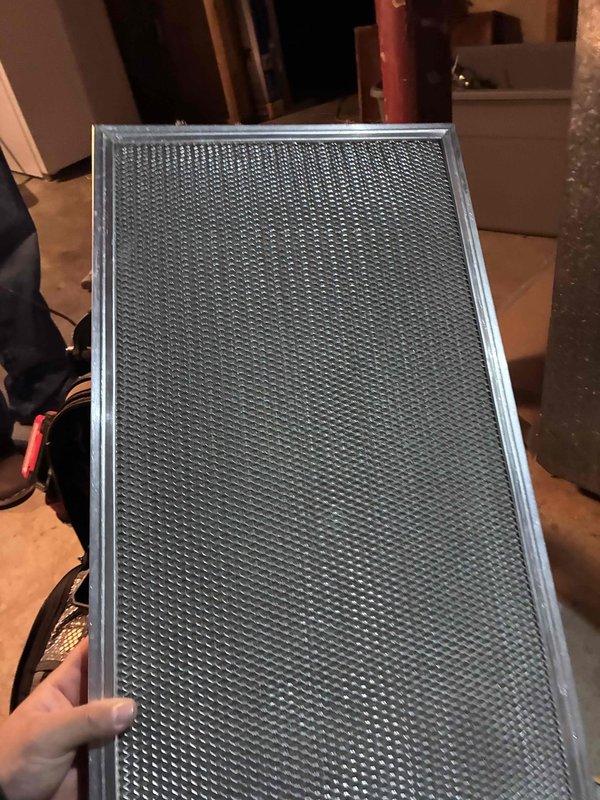 Completed routine furnace maintenance and filter inspection. Removed and examined the existing 14x25x1 air filter, which showed minimal contamination and remained in serviceable condition. Filter housing and frame components were found to be secure and properly seated within the HVAC system, ensuring optimal airflow and system efficiency.