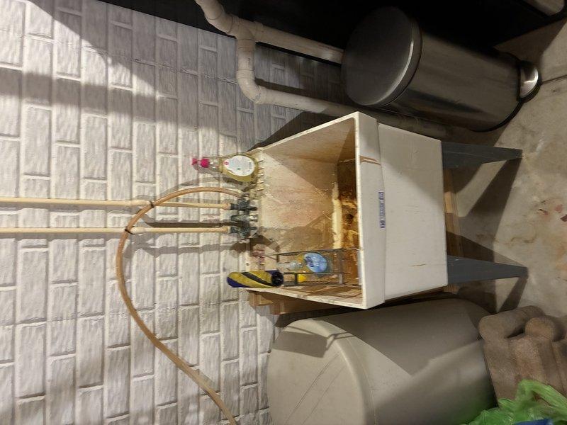 Completed installation and configuration of water treatment system components in attic utility space, including connection of PVC supply lines with shutoff valves to main treatment tank. Verified proper plumbing integration with existing copper piping, tested system operation, and confirmed all connections were secure and leak-free.