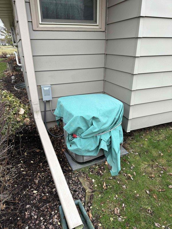 Completed comprehensive HVAC system replacement estimate for residential property. Assessed existing outdoor condenser unit currently protected with seasonal cover and evaluated electrical service capacity by inspecting main distribution panels in basement utility area. Documented equipment location, electrical infrastructure, and site conditions to develop specifications for new system installation including proper electrical requirements and outdoor unit placement considerations.