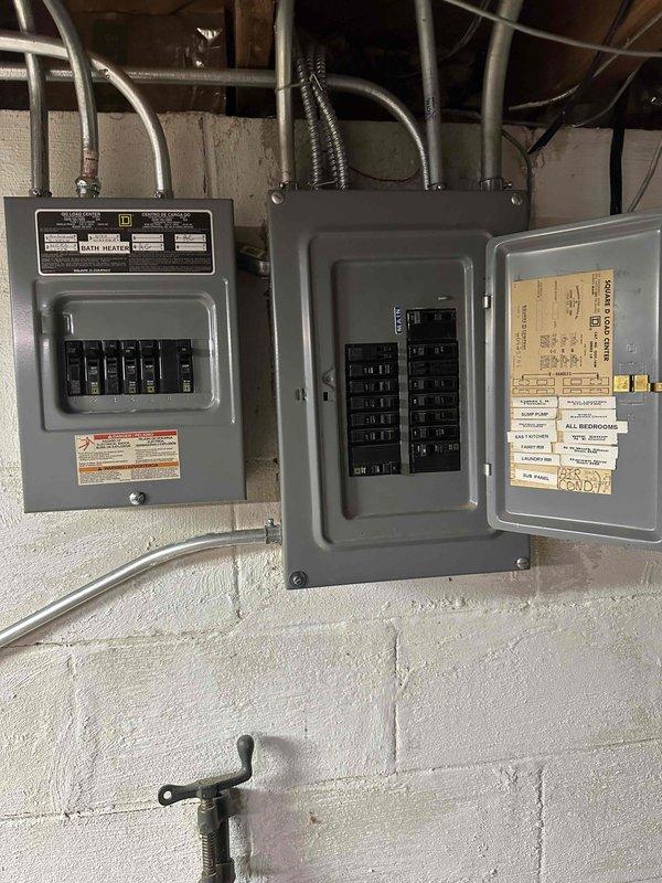 Completed comprehensive HVAC system replacement estimate for residential property. Assessed existing outdoor condenser unit currently protected with seasonal cover and evaluated electrical service capacity by inspecting main distribution panels in basement utility area. Documented equipment location, electrical infrastructure, and site conditions to develop specifications for new system installation including proper electrical requirements and outdoor unit placement considerations.