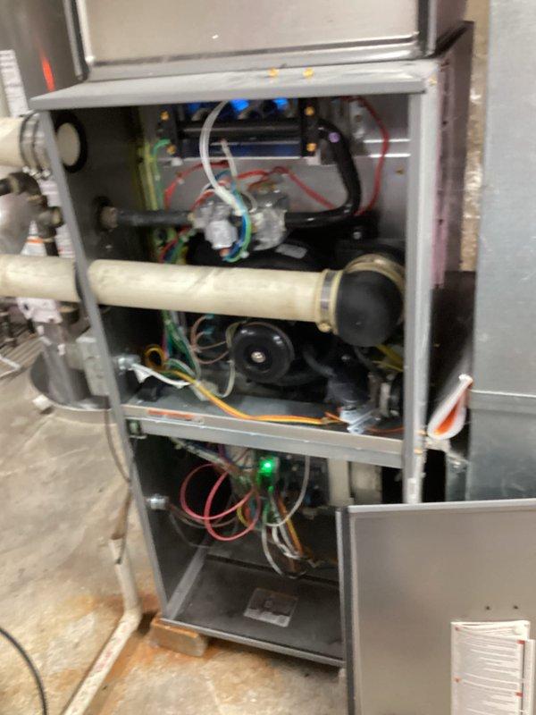 # HVAC Service Call - No Heat Condition

## Equipment Information
Furnace system, 10+ years old, high-efficiency condensing unit with electronic ignition control

## Problem Description
Unit not producing heat. Homeowner reported complete loss of heating function.

## Diagnostic Findings
Upon arrival, performed visual inspection and system diagnostics. Removed front access panel to examine internal components. Control board showed illuminated LED indicators suggesting power to the unit. Inspected blower motor assembly, inducer motor, and associated electrical connections. Examined condensate drainage system including pump assembly and discharge piping. All wire connections at motor terminals and control board appeared secure with no signs of burning or corrosion.

## Work Performed
Tested control board functionality and verified proper voltage supply. Inspected pressure switches and associated tubing for blockages or disconnections. Examined flame sensor and ignition system components.