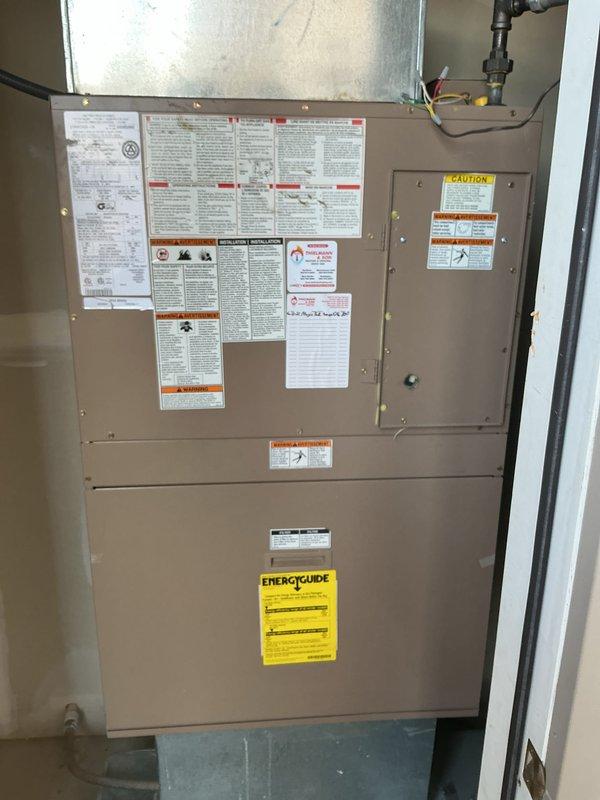 Completed routine maintenance inspection on residential furnace system. Documented current equipment condition, verified air filter installation and cleanliness, and inspected internal components including condensate drain pan and drainage system for proper operation. Unit found to be in good working condition with all safety labels intact and legible.