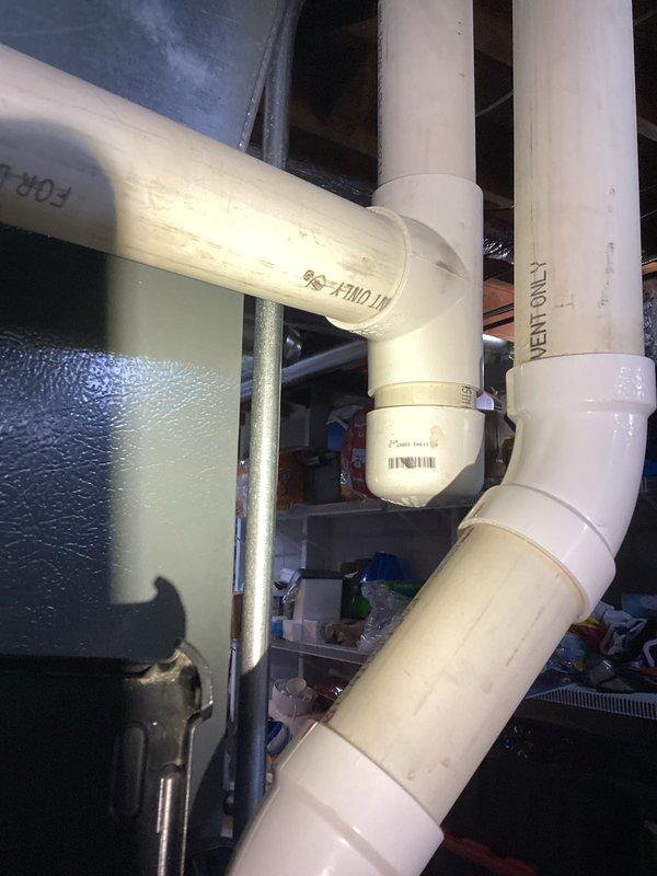 Completed prepaid HVAC maintenance visit and performed system inspection. Documented internal furnace components including gas valve assembly, blower motor housing, heat exchanger, wiring harness, and control board, all found to be in proper working condition. Photographed associated plumbing drainage system connected to the unit to verify proper condensate management and system integration.