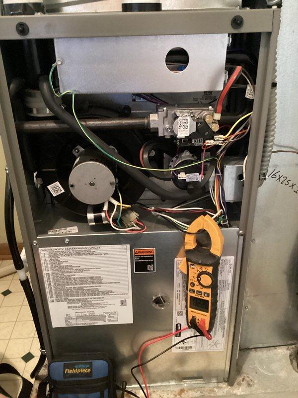 Completed comprehensive HVAC tune-up and system diagnostics on residential gas furnace unit. Performed electrical testing using digital multimeter to verify proper voltage and amperage across all components, inspected gas valve assembly and associated wiring connections, and evaluated blower motor operation. All components found operating within manufacturer specifications, and system returned to normal service with no issues identified.