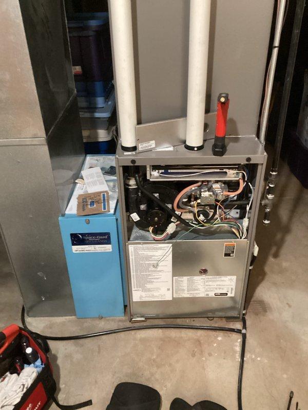 Completed scheduled prepaid maintenance visit on residential gas furnace system. Performed comprehensive inspection with access panel removed to examine internal components including gas valve assembly, heat exchanger, condensate drain system, and electrical connections. Conducted combustion analysis testing using calibrated digital analyzer, which confirmed optimal system performance with readings of 96.9% efficiency, 36 ppm CO, 8.4% CO₂, and 6.0% O₂ - all values within manufacturer specifications and safety standards. All mechanical components, copper refrigerant lines, PVC intake/exhaust venting, and associated water treatment equipment found operating properly with no deficiencies noted.