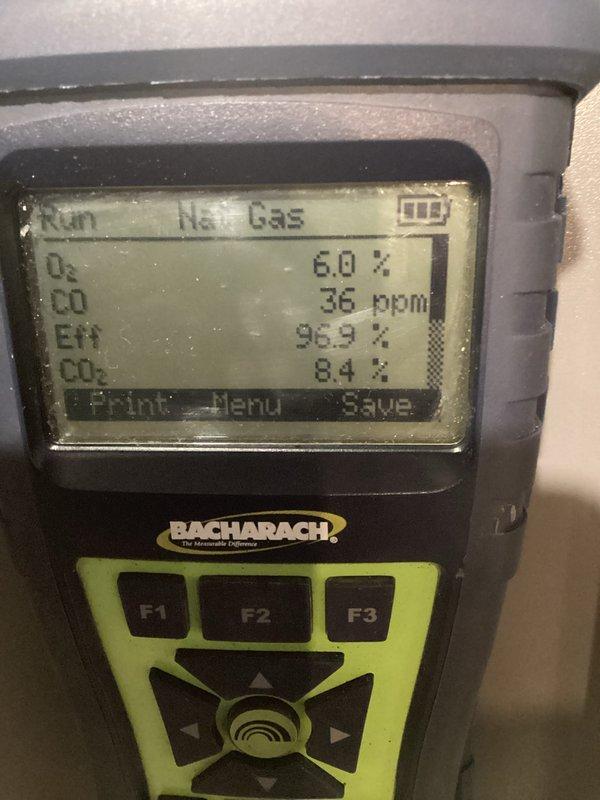 Completed scheduled prepaid maintenance visit on residential gas furnace system. Performed comprehensive inspection with access panel removed to examine internal components including gas valve assembly, heat exchanger, condensate drain system, and electrical connections. Conducted combustion analysis testing using calibrated digital analyzer, which confirmed optimal system performance with readings of 96.9% efficiency, 36 ppm CO, 8.4% CO₂, and 6.0% O₂ - all values within manufacturer specifications and safety standards. All mechanical components, copper refrigerant lines, PVC intake/exhaust venting, and associated water treatment equipment found operating properly with no deficiencies noted.