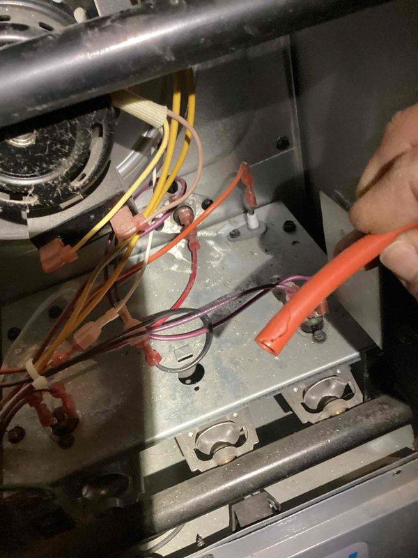 Responded to no heat call on HVAC system less than 10 years old. Upon inspection, found loose or disconnected low-voltage wiring at the furnace control board that was preventing the heating system from receiving proper signal from the thermostat. Reconnected and secured all low-voltage wire connections at the control board terminals, verified proper wire placement according to manufacturer specifications, and tested system operation. Unit fired successfully and restored heat to the residence.