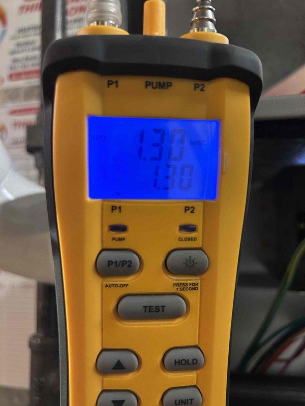 # HVAC Furnace Installation

Completed residential furnace installation in basement utility area. Installed new heating system with integrated ductwork assembly featuring galvanized sheet metal pentagonal trunk line for optimal airflow distribution. Connected copper refrigerant lines and configured system alongside existing Rheem water heater. Performed comprehensive system pressure testing using digital manifold gauge, verifying proper refrigerant pressures at 130 PSI on both high and low side ports to ensure system operates within manufacturer specifications. All mechanical connections secured, ductwork properly sealed, and system commissioned for reliable operation.