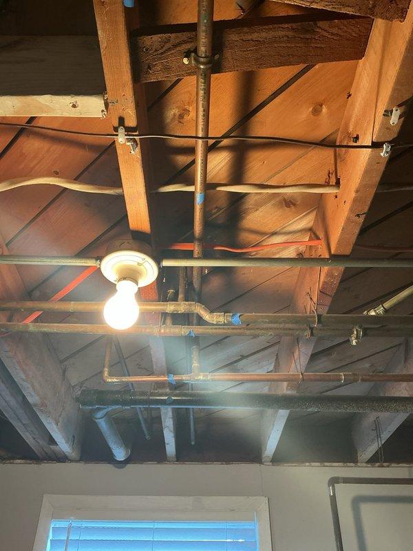 Performed comprehensive gas pressure test on commercial plumbing system with exposed piping infrastructure in basement utility area. Inspected all gas lines, connections, and fittings throughout the mechanical space, including copper supply lines, black iron gas piping, and associated pressure vessels. All connections tested and verified to be leak-free with proper operating pressure maintained throughout the system.