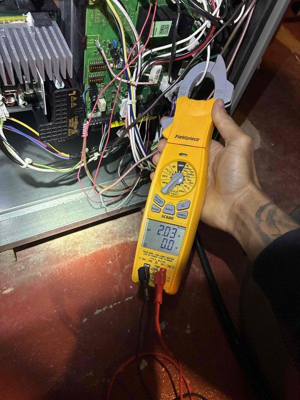 Completed comprehensive HVAC tune-up service including system diagnostics and performance verification. Performed electrical testing on control board circuitry using digital multimeter, confirming proper voltage readings at 203V and verifying all electronic components within manufacturer specifications. Verified thermostat operation and calibration, with unit maintaining setpoint at 75°F and displaying accurate temperature readings.