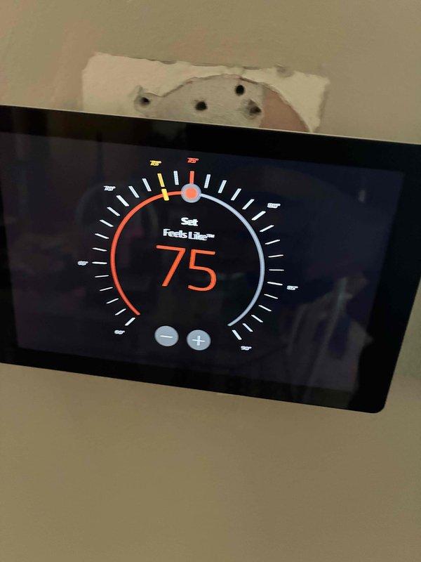 Completed comprehensive HVAC tune-up service including system diagnostics and performance verification. Performed electrical testing on control board circuitry using digital multimeter, confirming proper voltage readings at 203V and verifying all electronic components within manufacturer specifications. Verified thermostat operation and calibration, with unit maintaining setpoint at 75°F and displaying accurate temperature readings.