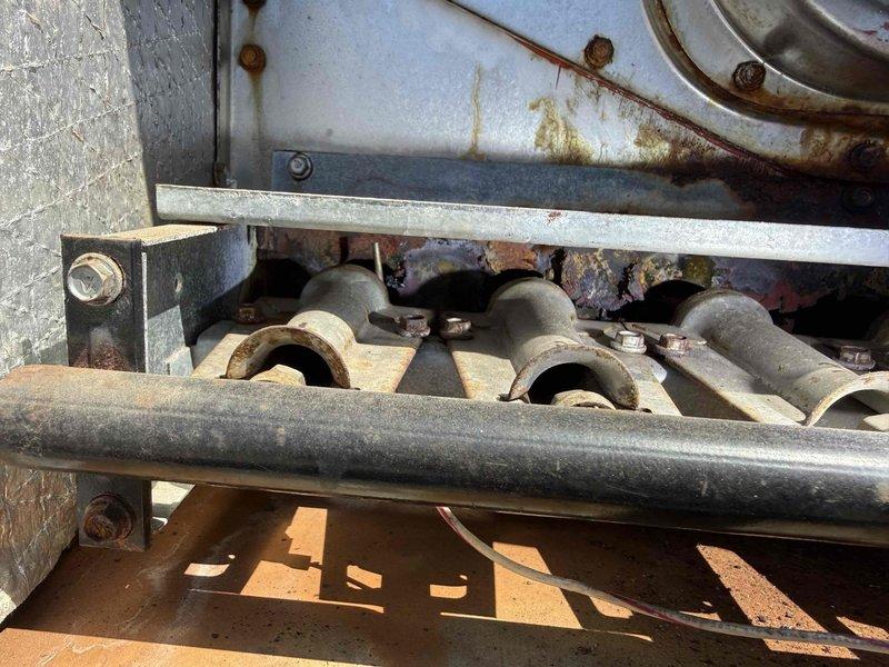 Performed comprehensive inspection of commercial furnace system revealing significant deterioration and operational concerns. Documented extensive rust staining on interior panels and heat exchanger components, along with severe frost and ice accumulation on burner tubes indicating potential combustion issues or heat exchanger failure. The heavy frost buildup combined with underlying corrosion suggests compromised system integrity requiring immediate attention to prevent safety hazards and system failure.