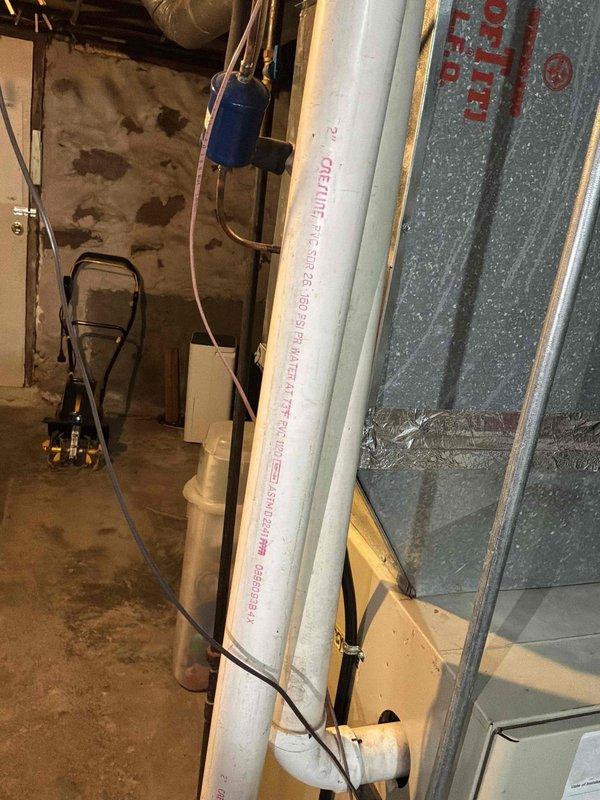 Conducted comprehensive assessment of existing HVAC system in basement utility area for equipment replacement estimate. Evaluated current infrastructure including ductwork configuration, electrical service capacity at main breaker panel, and available clearances for new equipment installation. Documented existing PVC drainage lines, insulation materials, and spatial constraints that will impact replacement unit positioning. Assessed electrical panel capacity and circuit availability to ensure adequate power supply for upgraded HVAC equipment. Photographed current conditions including utility room layout, wall-mounted electrical distribution panel with existing circuit assignments, and surrounding infrastructure to develop accurate replacement specifications and installation plan.