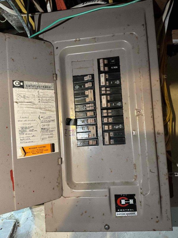 Conducted comprehensive assessment of existing HVAC system in basement utility area for equipment replacement estimate. Evaluated current infrastructure including ductwork configuration, electrical service capacity at main breaker panel, and available clearances for new equipment installation. Documented existing PVC drainage lines, insulation materials, and spatial constraints that will impact replacement unit positioning. Assessed electrical panel capacity and circuit availability to ensure adequate power supply for upgraded HVAC equipment. Photographed current conditions including utility room layout, wall-mounted electrical distribution panel with existing circuit assignments, and surrounding infrastructure to develop accurate replacement specifications and installation plan.