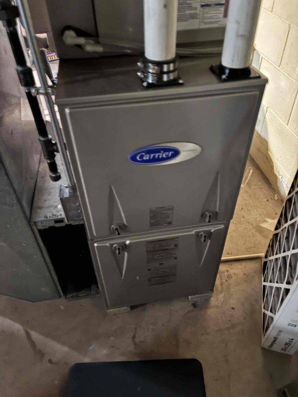 Completed prepaid HVAC maintenance inspection on Carrier brand furnace unit. Performed visual assessment of system components, verified proper installation of exhaust venting, inspected electrical connections and wiring harnesses, and documented equipment condition with serial number verification. All components found operating within normal parameters with no immediate service needs identified.