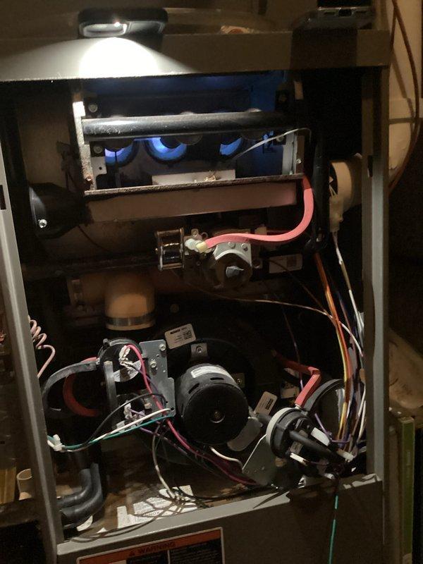 Completed scheduled HVAC maintenance inspection on heating unit. Removed access panel to perform thorough examination of furnace components including blower motor assembly, electrical connections, control board, and wiring harnesses. All mechanical and electrical components were found to be in proper working order with connections secure and intact. Unit tested and confirmed operational.