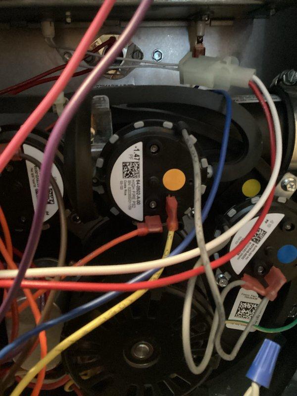 Completed comprehensive tune-up and safety inspection on residential HVAC system. Performed detailed examination of furnace components including pressure switch assembly, electrical connections, and wiring harness; verified all wire terminations secure and properly connected. Inspected condensate drain system with PVC piping configuration, confirmed proper drainage and trap functionality. All system components tested and operating within manufacturer specifications.