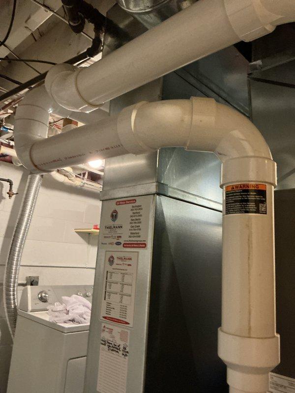 Completed comprehensive tune-up service on Lennox high-efficiency gas furnace system located in utility room. Performed full system inspection including burner assembly, heat exchanger, blower motor, and all safety controls; verified proper operation of PVC intake and exhaust venting system; tested gas pressure and combustion efficiency within manufacturer specifications; and confirmed all electrical connections, thermostat communication, and condensate drainage functioning correctly.