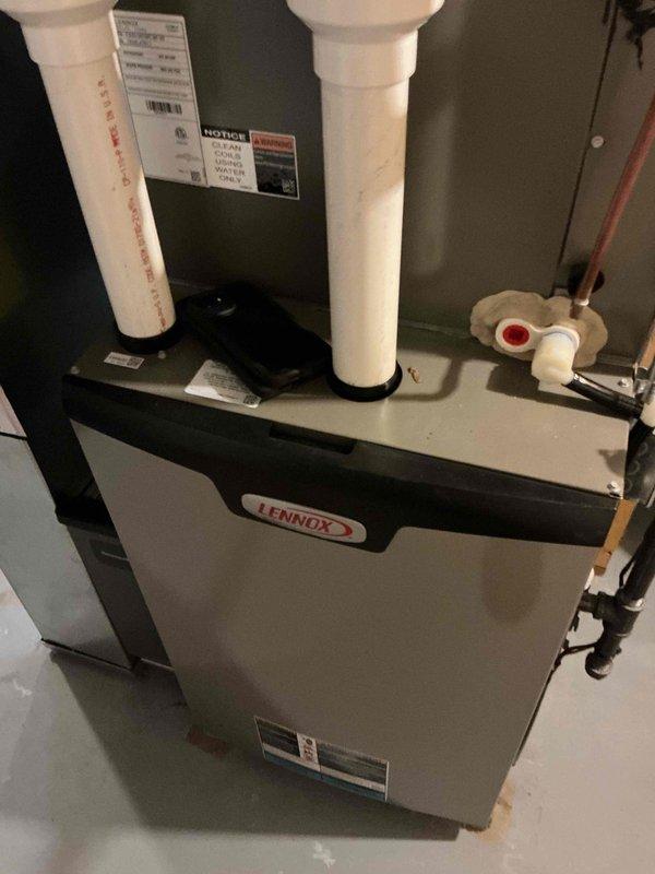 Completed comprehensive tune-up service on Lennox high-efficiency gas furnace system located in utility room. Performed full system inspection including burner assembly, heat exchanger, blower motor, and all safety controls; verified proper operation of PVC intake and exhaust venting system; tested gas pressure and combustion efficiency within manufacturer specifications; and confirmed all electrical connections, thermostat communication, and condensate drainage functioning correctly.