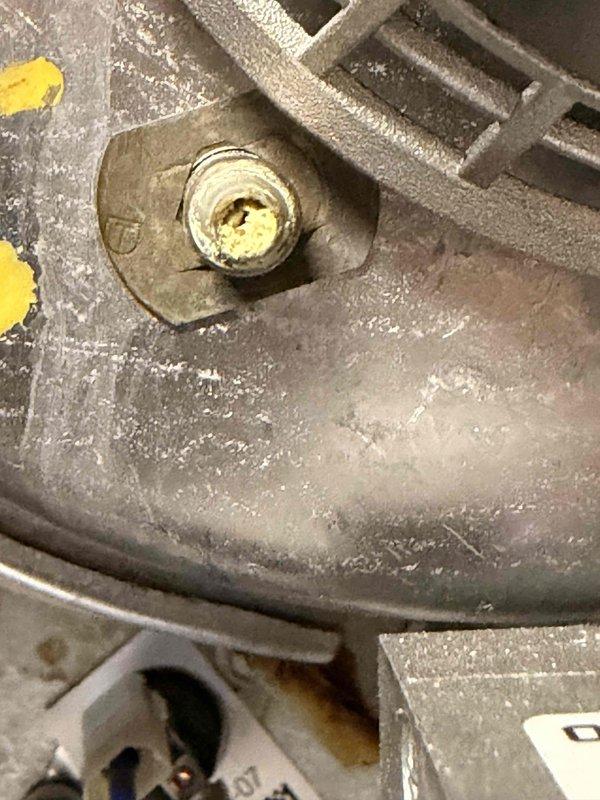 # HVAC Service - No Heat Call

Responded to no heat call on furnace less than 10 years old. Upon inspection, discovered heavy dust and debris accumulation throughout the blower compartment and on critical components. Blower motor assembly showed significant dust buildup on housing and ventilation slots, which can restrict airflow and cause overheating protection to activate. Inspected gas valve assembly and verified all electrical connections were secure. Multiple wire terminals and connectors showed proper installation with no signs of loose connections or overheating. Confirmed all manufacturer labels and component identifiers were intact. Assessed motor mounting hardware and found bolt secure with no vibration issues. Cleaned accumulated dust from blower motor housing, ventilation slots, and surrounding metal surfaces to restore proper airflow and heat transfer. Verified gas valve connections and associated piping showed no signs of leaks or damage. Checked all color-coded wiring ha