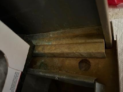 Completed furnace inspection and maintenance in residential attic installation. Examined heat exchanger components showing normal patina and oxidation consistent with system age, confirmed structural integrity of ductwork connections and verified proper clearances around equipment. Assessed attic insulation placement around furnace area to ensure adequate ventilation and code-compliant spacing from heating components.