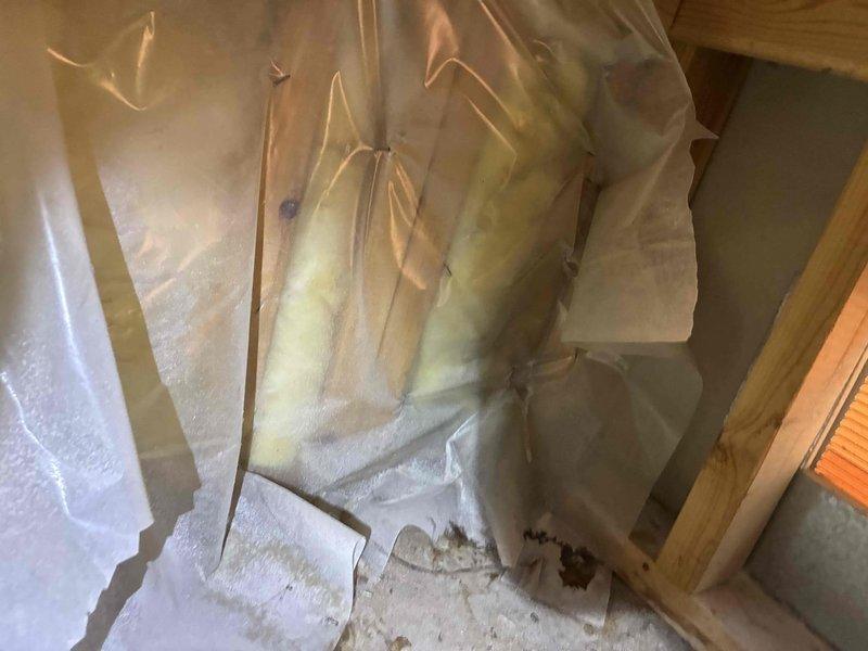 Completed furnace inspection and maintenance in residential attic installation. Examined heat exchanger components showing normal patina and oxidation consistent with system age, confirmed structural integrity of ductwork connections and verified proper clearances around equipment. Assessed attic insulation placement around furnace area to ensure adequate ventilation and code-compliant spacing from heating components.