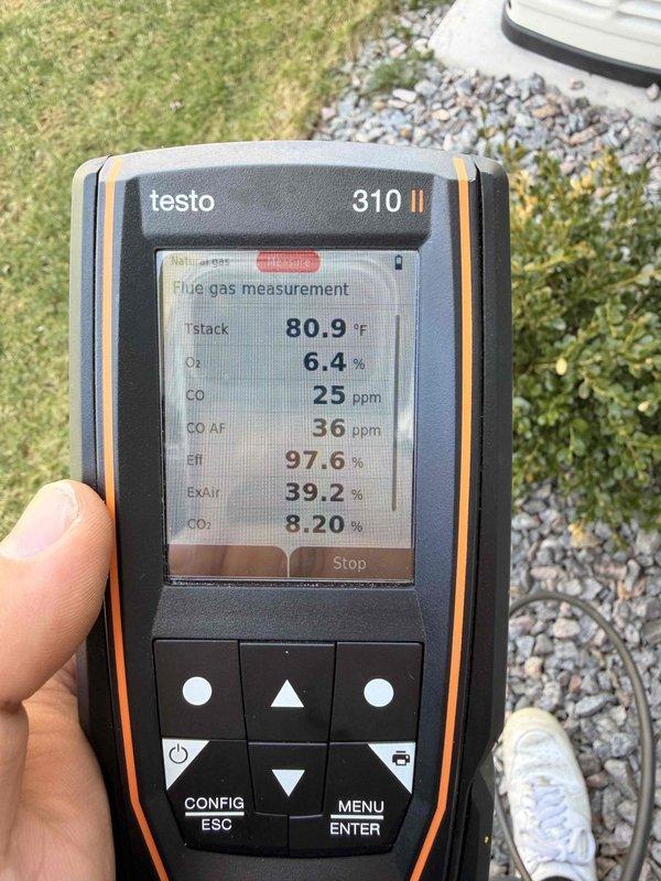 Performed combustion analysis and efficiency testing on residential furnace system. Flue gas measurements indicated temperature of 80.9°F, oxygen level of 6.4%, and carbon monoxide reading of 25 ppm, confirming proper combustion and safe operation within acceptable parameters. Inspected PVC condensate drain piping installation in crawl space area, verifying proper slope and secure connections of Schedule 40 piping with appropriate support and insulation wrapping where required.