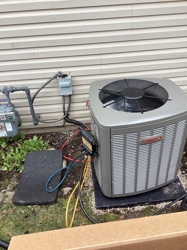 Completed full HVAC system installation including new Lennox furnace and outdoor condensing unit. Installed furnace in interior mechanical space with proper venting and gas connections, mounted outdoor Lennox condenser on composite pad against building exterior with appropriate clearances, and established refrigerant lines between indoor and outdoor components. Configured PVC condensate drainage system, made all electrical connections including disconnect box, and verified system operation using differential manometer to confirm proper gas pressure at 1.10" W.C. All diagnostic codes reviewed and system commissioned successfully with equipment operating within manufacturer specifications.