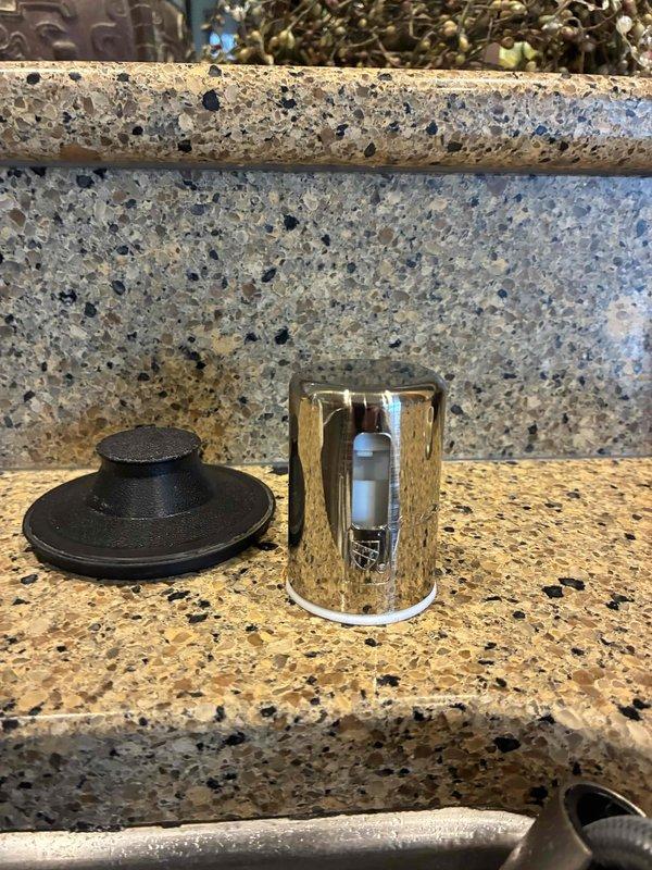 # Plumbing Install - Outdoor Spigot/Shower

Installed new garbage disposal unit beneath kitchen sink, including complete mounting assembly with stainless steel flange connection to sink drain. Connected disposal to existing drainage system using white PVC P-trap configuration and secured all pipe joints. Ran electrical connection from disposal unit to cabinet-mounted outlet and verified proper power supply. Installed black corrugated discharge hose for drainage routing and ensured all connections were watertight and secure.